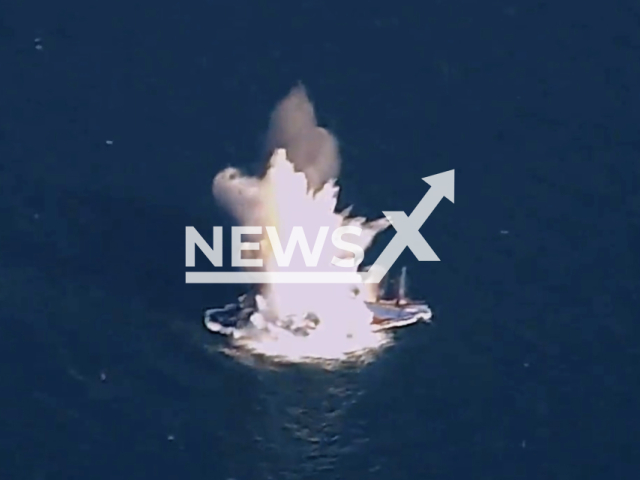 The US shows off its ability to destroy enemy warships by blasting cargo ship out of the sea. Note: This picture is a screenshot from the video. (@AFResearchLab/Newsflash)