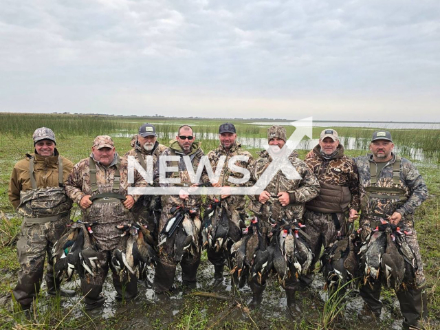 US tourists pose with hunted mallards and scaup in San Javier, Argentina, undated. The slaughter included species protected by law and violated the quota of animals that can be hunted. Note: Picture taken from social media. (Ceydas Entre Rios/Newsflash)