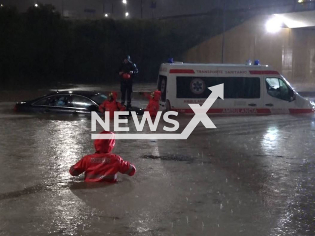 Firefighters rescue people trapped in cars during flooding in Paterna, Spain, on 4th May. Note: Photo from firefighters.
(@BombersValencia/Newsflash)