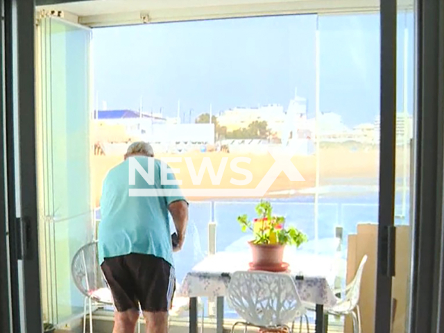 Picture shows the giant canvas that replaces the sea view in Torrevieja, Spain, undated. Residents view has been blocked by a building. Note: Image is a screenshot from video. (Newsflash)