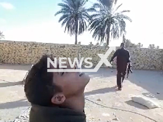 Iraqi father shoots a bullet at a cigarette in his child's mouth.
Note: Photo is a screenshot from a video(Newsflash).