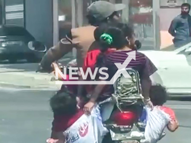 Video shows a father and his five children riding a two-person motorcycle in Adana, Turkey. The driver reportedly ignored the warnings of those around him and continued on his way.
Note: Photo is screenshot from a video (Newsflash)