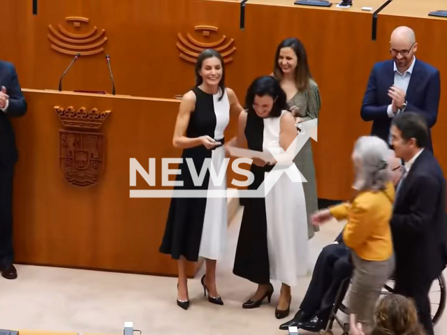 Queen Letizia of Spain (center left) in the dress signed by Mango at the Royal Board on Disability Council in May 2022, next to the woman (center right) wearing the same dress. Note: Photo is a screenshot from a video(Newsflash).