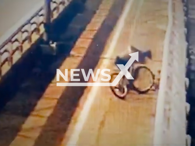 Image shows the suspect robbing the woman, undated photo. It took place on the Mapo Bridge in Seoul, South Korea, Aug. 18, 2024. Note: Photo is a screenshot from a video. (Newsflash)