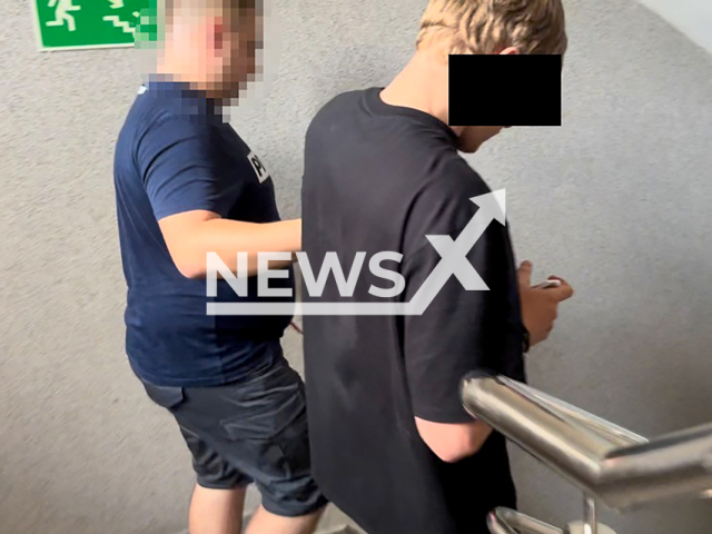 Image shows the 24-year-old American national getting arrested, undated photo. It happened after he threw a TV from the fourth floor of a building in Warsaw, Poland, August, 2024. Note: Licensed content. (KSP/Newsflash)