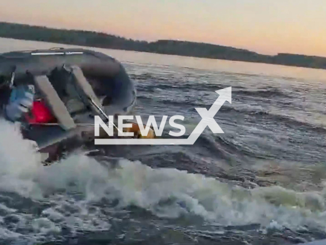 Rescuers tame out-of-control motorboat at Mozhaisk water reservoir in the west of Moscow region, Russia on Monday, Sep. 9, 2024. Two men fell out of an out-of-control boat and fishermen picked them up on board. Note: Photo a is screenshot from a video(@mosoblspas/Newsflash)