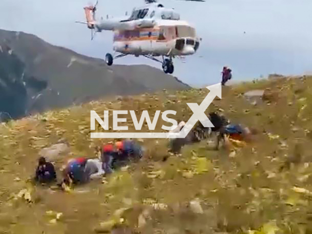 Rescuers evacuate seven lost people with help of helicopter into the mountains of Almaty region, southeastern Kazakhstan on Monday, Sep. 9, 2024. The rescue operation lasted more than 15 hours. Note: Photo a is screenshot from a video(@qr_tjm/Newsflash)