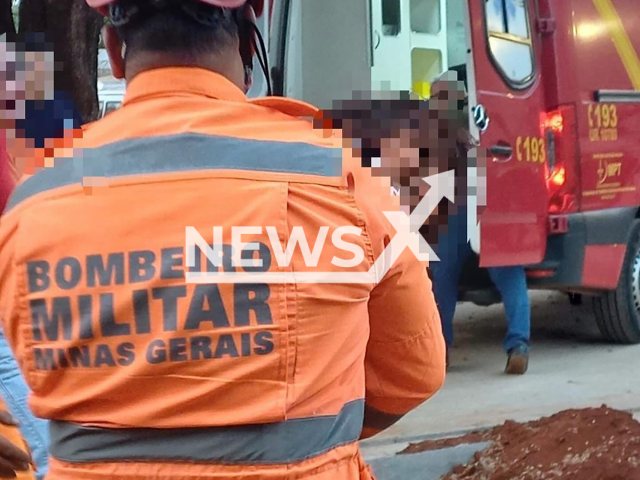 Image shows a fireman carrying the injured girl, undated photo. She was saved in Frutal, Minas Gerais State, Brazil. Note: Licensed content. (@bombeirosfrutal/Newsflash)