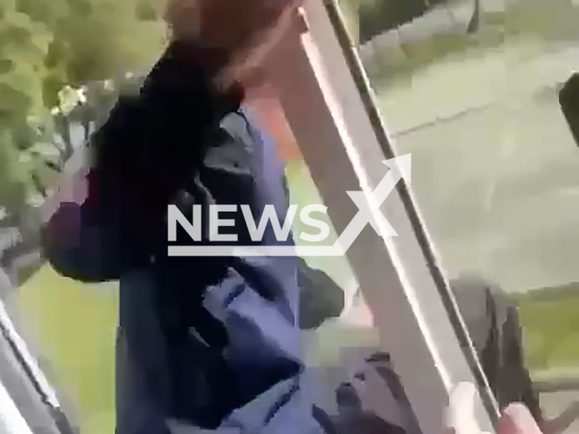 A schoolboy jumps out of window of the school to the applause and screams of other children in Moscow, Russia on Thursday, Sep. 5, 2024. In the evening at home his back started to hurt and his parents called an ambulance.  Note: Photo is a screenshot from a video. (Newsflash)