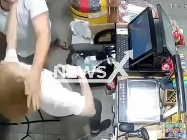 A man beats up seller at candy shop in a mall in Novocherkassk, Rostov Oblast, Russia on Wednesday, Sep. 11, 2024. The attacker allegedly didn't like the long hair of the seller. Note: Photo is a screenshot from a video. (Newsflash)