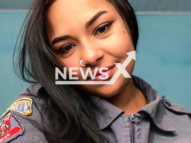 Firefighter Jennifer Mily, 21, poses in undated photo. She is is hospitalised in serious condition after removing her oxygen mask to help an eight-year-old child during a fire in Nova Alianca, Brazil. Note: Picture is taken from social media. (@_j.sereia/Newsflash)