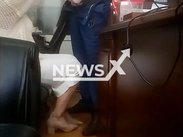 The Communist Party deputy Denis Parfenov, 36, spends time with unidentified woman in his office in Moscow, Russia, undated. It caused outrage after video was leaked online.Note: Photo is a screenshot from a video. (Newsflash)