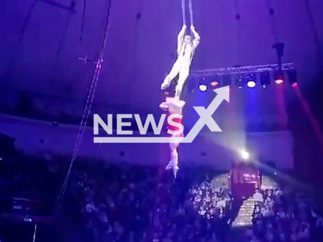 Gymnast falls from six-meter height during performance at circus in Kemerovo, Russia, undated. She broke both arms. Note: Photo a is screenshot from a video(Newsflash)