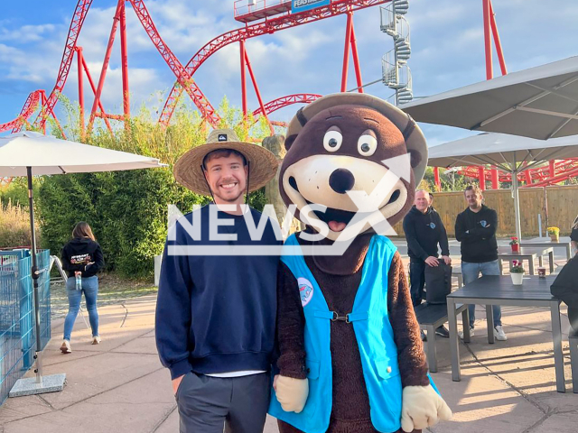 MrBeast poses with mascot “Buddel” in front of the roller coaster in the amusement park “Belantis” in Leipzig, Germany, undated. He rented out the entire park to mark the launch of his chocolate in Germany. Note: Picture is taken from social media. (@belantis_abenteuerreich/Newsflash)