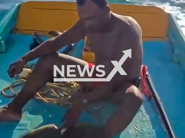 Image shows the fisherman, undated photo. He discovered a plastic bottle in a moray eel's body in Maragogi, Alagoas State, Brazil. Note: Photo is a screenshot from a video. (Newsflash)