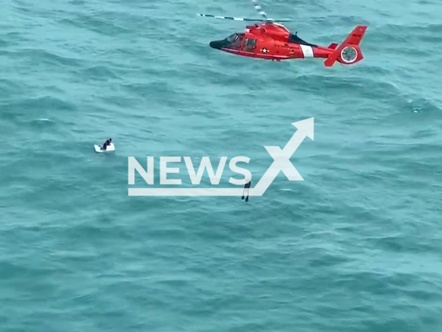 Coast Guard helicopter saves man clinging to cooler 30 miles off Longboat Key, Florida in the United States on Thursday, Oct. 10, 2024. Officials have not released the man's name, but they confirmed that he is the captain of a fishing vessel. Note: Photo is a screenshot from a video. (U.S. Coast Guard/Newsflash)