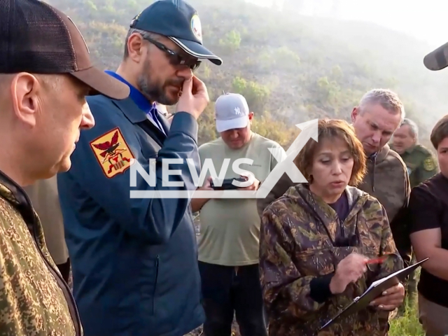 Governor of Zabaikalsky Krai Alexander Osipov picks his nose and wipes his hand on the Head of the regional forestry department Elena Shalyapina in Karymsky District, Zabaykalsky Krai, Russia in July, 2024. Government said it happened because of the flying midges.Note: Photo is a screenshot from a video. (Government of Zabaikalsky Krai,  NF/NewsX)