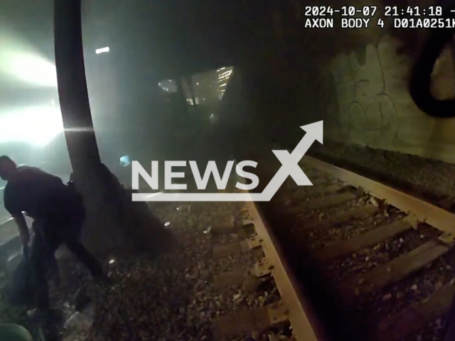 Seattle officers save a man from an oncoming train in a dramatic rescue in Seattle, Washington in the United States on Monday, Oct. 7, 2024. According to the police, the man slipped and fell approximately 25 feet onto the rocks below, sustaining serious injuries and was unable to move. Note: Photo a is screenshot from a video(@SeattlePolice/NF/newsX)