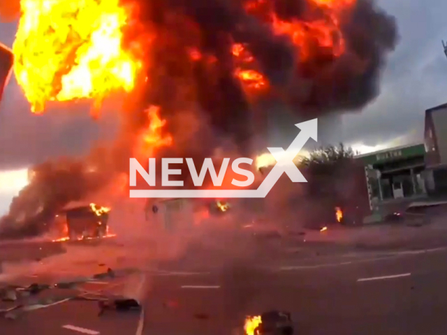 POV firefighter's footage shows the explosion at gas station in Grozny, Chechnya, Russia on Saturday, Oct. 12, 2024. Burning debris reached firefighters.  Note: Photo is a screenshot from a video. (@mchs_95, NF/newsX)