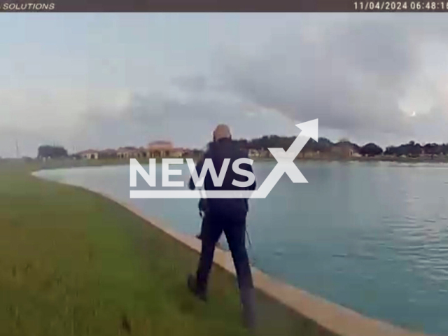 Sergeant Peters and Officer Garcia spring into action to rescue three stranded dogs safely pull them out to dry land in Manvel, Texas in the United States on Monday, Oct. 4, 2024. Note: Photo a is screenshot from a video(@ManvelPD/NF/newsX)