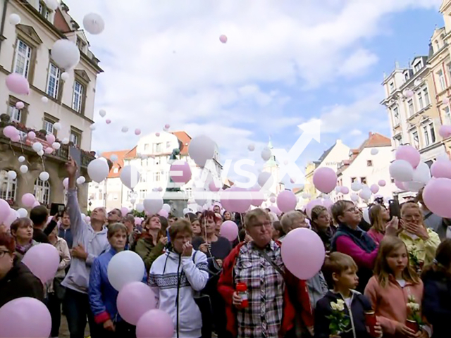 Image shows the citizens of Doebeln, Saxony State, Germany, mourning the death of Valeriia, aged 9, undated photo. She was strangled to death by her mother's 37-year-old ex-boyfriend. Note: Photo is a screenshot from a video. (NF/newsX)