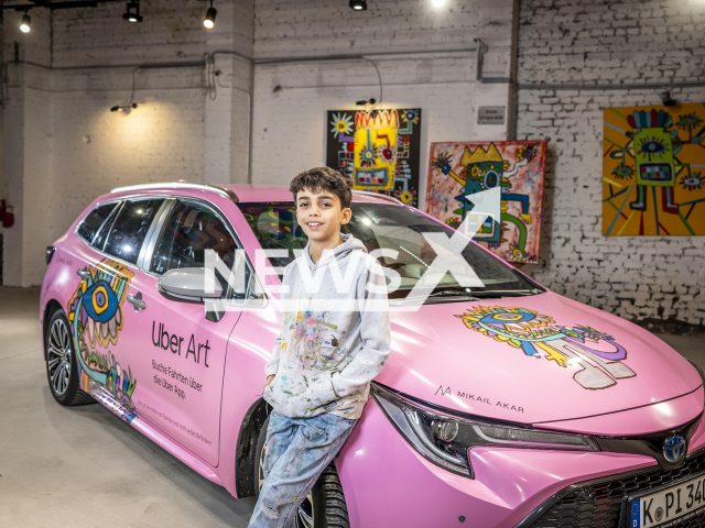 Mikail Akar, 12, from Cologne, North Rhine-Westphalia State, Germany, poses in undated photo. He painted a total of 10 Uber cars. Note: We have obtained permission to use this photo from Management Mikailakar. (Christian Knieps/NF/newsX)