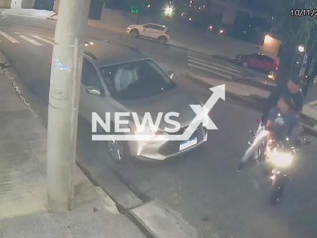 Image shows a cop opening fire on two thieves, undated photo. It happened in Santo Andre, Sao Paulo State, Brazil, on Sunday, Nov. 10, 2024. Note: Photo is a screenshot from a video. (NF/newsX)