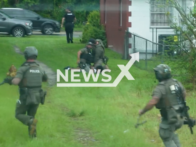 JSO officers are executing a raid on homes near Ken Knight Drive in Jacksonville, Florida, United States, on Tuesday, 12 November 2024. Thirteen suspects are being arrested and are facing a combined total of 67 separate charges as part of a large-scale drug bust operation.Note: Photo is a screenshot from a video. (@JacksonvilleSheriffsOffice/NF/newsX)