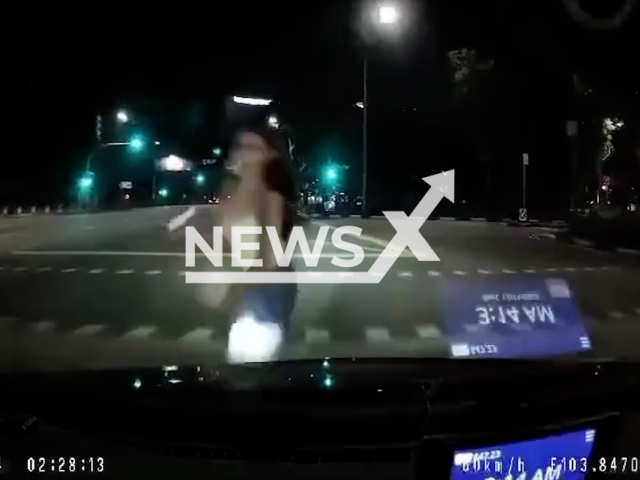 Taxi hits woman jaywalking in Singapore, Nov. 13, 2024. She was taken to hospital. Note: Photo is a screenshot from a video. (NF/newsX)