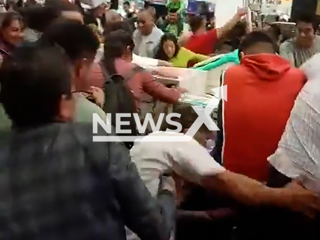 A group of people engage in a fight over store offer in Tehuacan, Mexico, undated. 'El Buen Fin' is a commercial event held annually in Mexico. Note: Photo is a screenshot from a video. (NF/newsX)