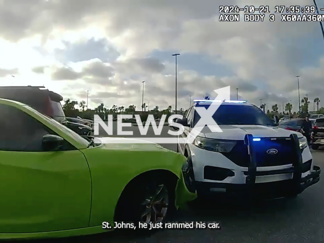 A suspect 33-year-old Devon Spencer in a green Dodge Charger smashes patrol cars and then asks what did I do when arrested in St. Johns County, Florida in the United States on the 21st of October 2024.
Note: Photo is a screenshot from a video. (@StJohnsSheriffsOffice/NF/newsX)