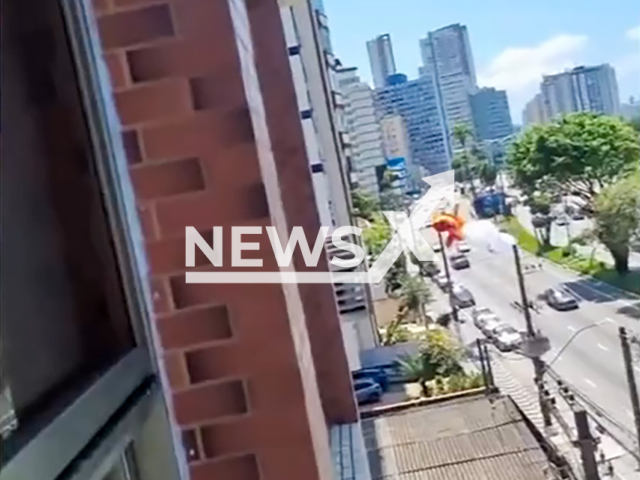 Paraglider pilot ends on voltage wires during a flight session in Sao Vicente, Brazil, Sunday, Nov. 17, 2024. He was left hanging. Note: Photo is a screenshot from a video. (NF/newsX)