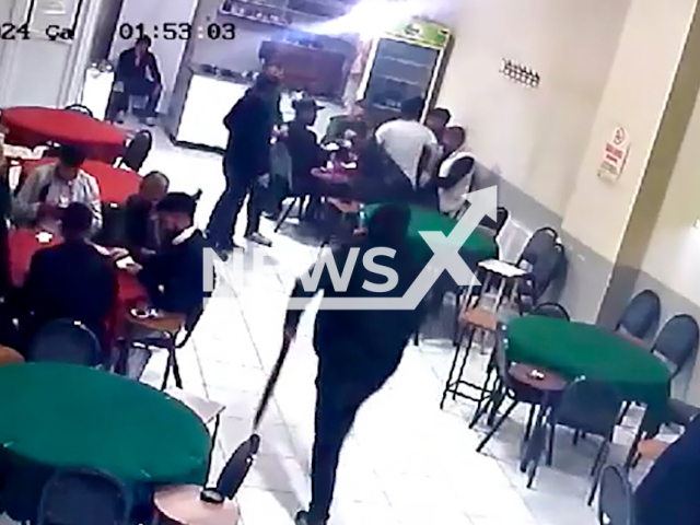 A man armed with a shotgun enters a coffee shop and shoots a victim playing games with friends at a table in Elazig, Turkey, on Wednesday, Nov. 20, 2024. Note: Photo is a screenshot from a video. (NF/newsX)