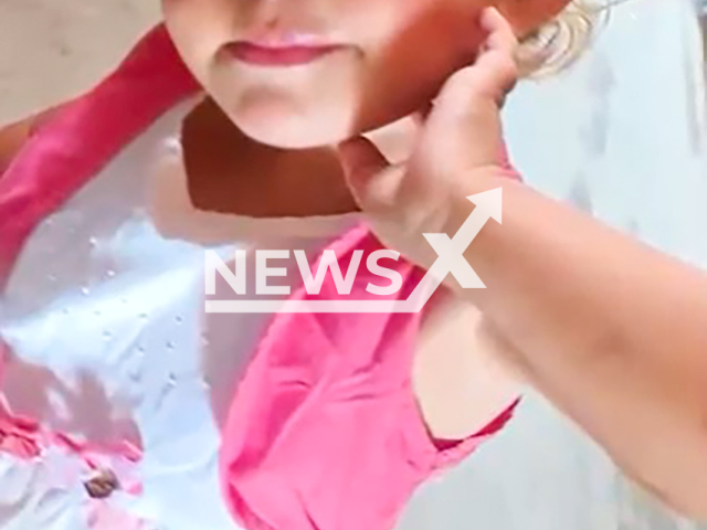 Rhaaby Miray da Silva Santos, 2, poses in undated photo. She and her mother were killed in a rural area of Itapeva, Brazil. Note: Private photo taken from local media. (NF/newsX)