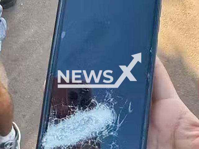 Picture shows the victim's phone after being shot with a firearm in Umuarama, Brazil, undated. The victim suffered a superficial wound. Note: Private photo taken from local media. (NF/newsX)