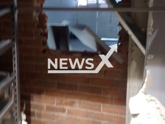 Picture shows the hole that the criminals made to gain access to the warehouse in Bogota, Colombia, undated. The thieves stole millions of dollars worth of merchandise. Note: Private photo taken from local media. (NF/newsX)