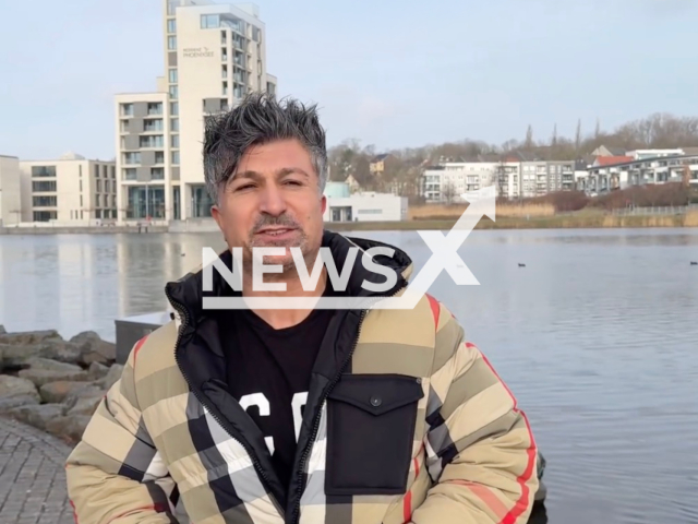 Image shows Kursat Yildirim, 43, standing at the KonigSee lake, Dortmund, North Rhine-Westphalia State, Germany, undated photo. He has bought a EUR 1.5 million penthouse at the location. Note: Photo is a screenshot from a video. (@chico_lottomillionaer/Newsflash)