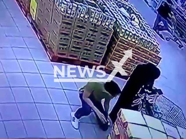 Man appears to record video under woman's skirt at a supermarket in Jenjarom, Kuala Langat in Malaysia, undated. The woman reported the incident on Dec. 9, 2024. Note: Photo is a screenshot from a video. (NF/newsX)