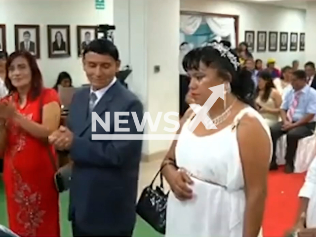 Bride refuses to marry and runs away from her wedding in Bagua, Peru, Feb. 14, 2025. The ceremony brought together 24 couples in the municipal auditorium. Note: Photo is a screenshot from a video. (Municipality of Bagua/Newsflash/NX)