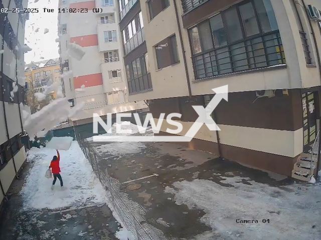 This image is a screen grab of the video supplied titled NewsX-SnowDeath-01.mp4: Falling snow crushes mother in Chiajna, near Bucharest, Romania, Feb. 25, 2025.(Clipzilla/NX)