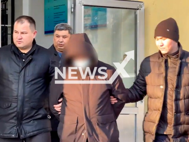 This image is a screen grab of the video supplied titled NewsX-FraudArrest-01.mp4: Police arrest fraudsters who swindled 46 million tenge from a pensioner in Shymkent, Kazakhstan, undated.  The victim of the fraud was a 69-year-old city resident.(Clipzilla/NX)