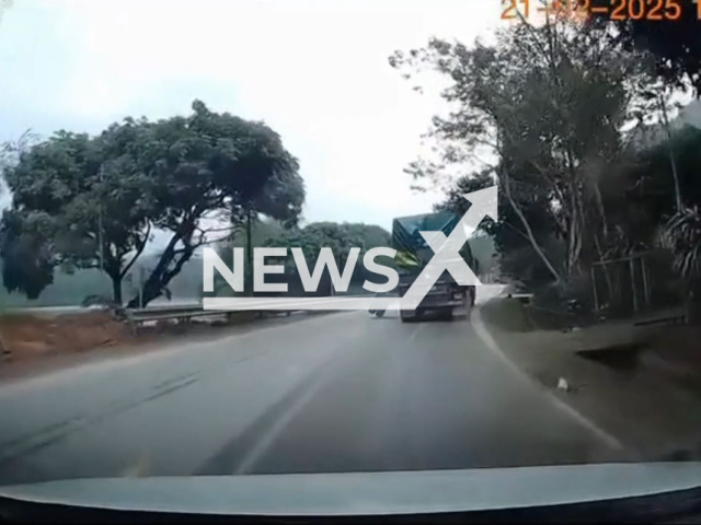 Trailer tire crashes man cutting grass on side of a road in Ham Yen District, Vietnam, Feb. 21, 2025. The man died. Note: Photo is a screenshot from a video(Newsflash/NX)