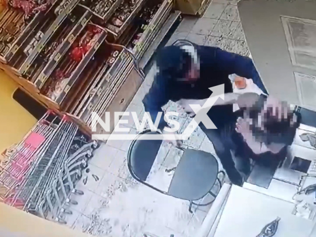 This image is a screen grab of the video supplied titled NewsX-StoreThreatens-01.mp4: A man attacks an employee with a broken bottle in Omsk, Russia, on Mar.07, 2025. The attacker was arrested.(The Ministry of Internal Affairs of Russia for Omsk Region/Clipzilla/NX)