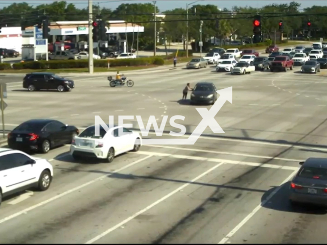 A group of good samaritans sprang into action on 5th of May 2022 to help a woman who suffered a medical episode while driving on Woolbright Road, Boynton Beach, United States, Florida. Note: Photo is a screenshot from the video (Boynton Beach Police Department/Newsflash)