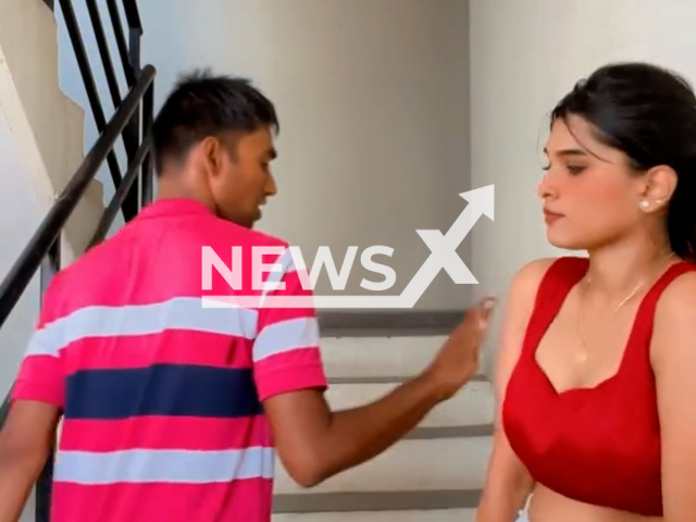 Influencer slaps man for touching her while she was filming reels on building stairs, undated. Note: Photo is a screenshot from a video. (@i_mansi_21/Newsflash/NX)