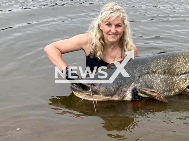 Picture shows Christine Hein with the fish she pulled from Oder river in Germany, undated. She secured the title of “Angler Queen 2024”. Note: Permission obtained for the photo from Christine Hein. (Christine Hein/Newsflash/NX)