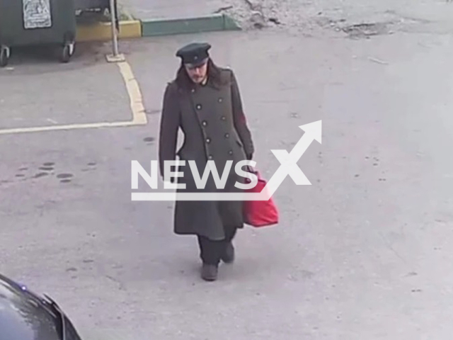 Picture shows the man in the overcoat, undated. He dragged animals home in bags. Note: Photo from animal organisation taken from local media. (Zoopatrul NN/Newsflash/NX)