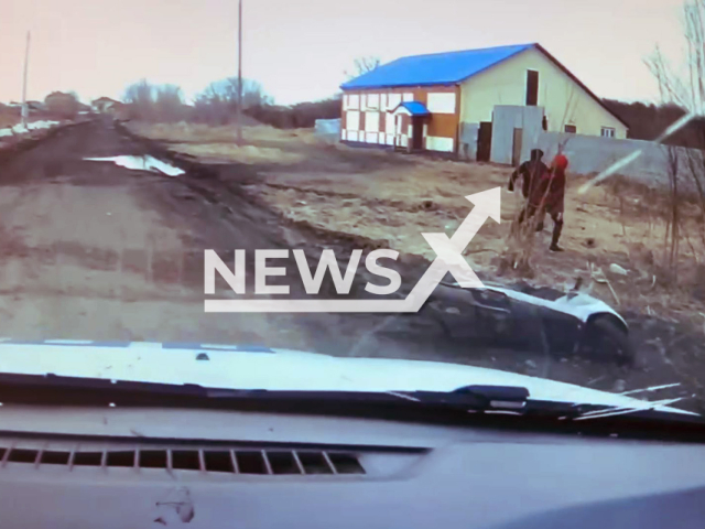 This image is a screen grab of the video supplied titled NewsX-ColdRunTeen-01.mp4: A 16-year-old rider and his friend abandon moped and jump into river as they flee from traffic police in Poronaysk, Russia, on Monday, 28 April, 2025.(Clipzilla/NX)