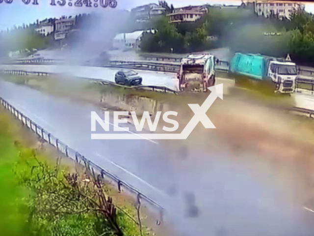 This image is a screen grab of the video supplied titled NewsX-TwoAccidents-01.mp4: CCTV footage shows two trucks losing control and skidding on a slippery road in Buyukcekmece, Turkey on Thursday, May 1, 2025.(Clipzilla/NX)