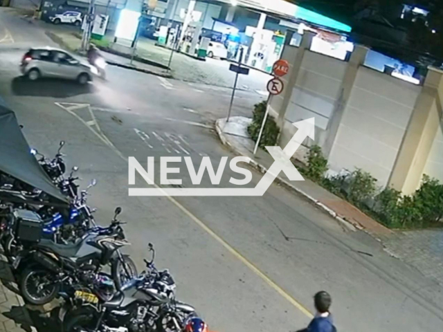 This image is a screen grab of the video supplied titled NewsX-YakutiaFire-01.mp4: CCTV footage shows a motorcyclist ignoring the required detour and slamming into a car in the opposite direction in Juiz de Fora, Brazil on Tuesday, May 6, 2025.(Clipzilla/NX)